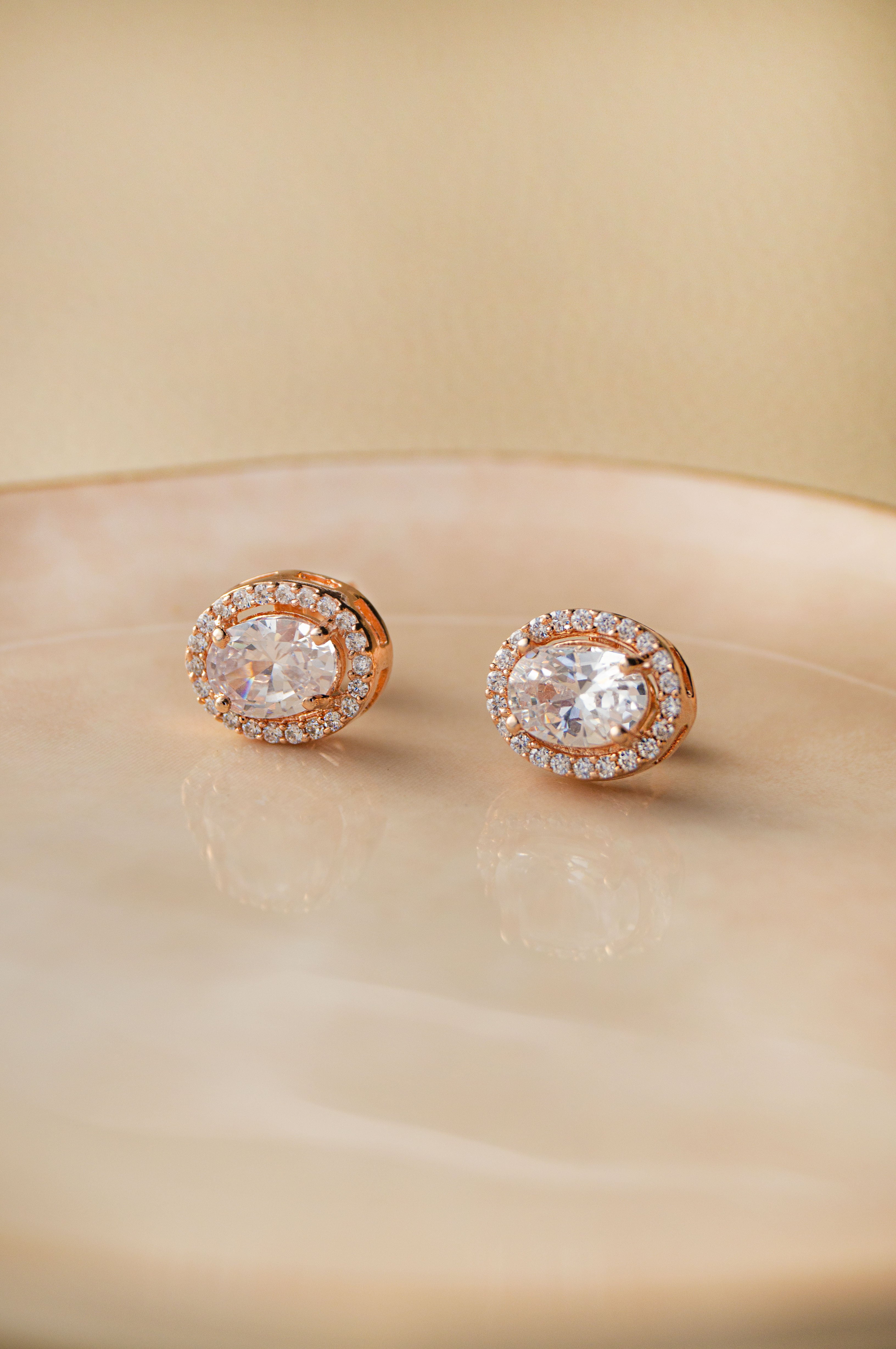 Rose gold halo on sale earrings